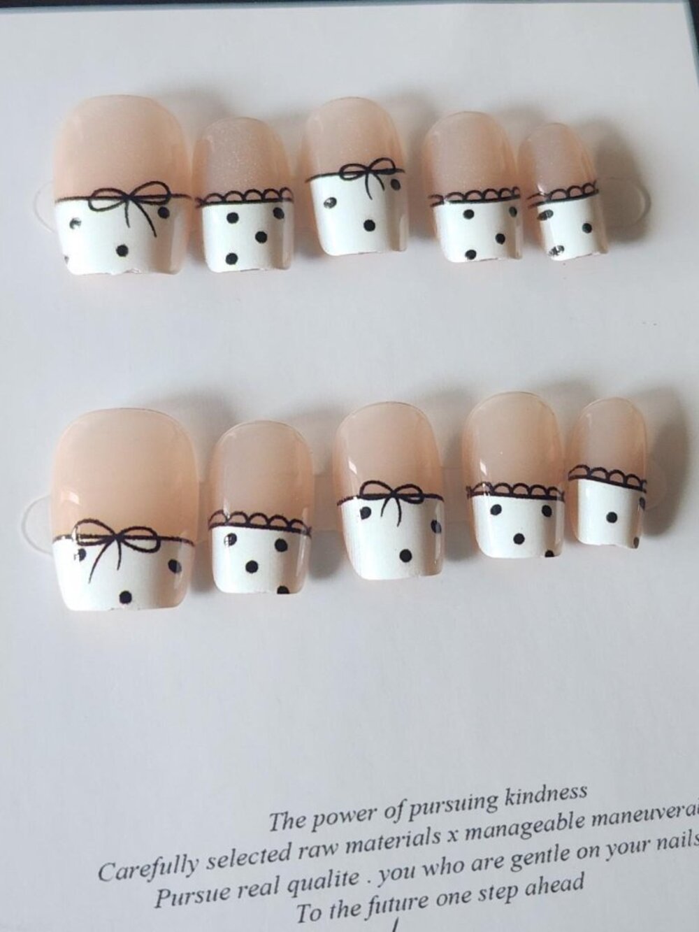White and black polka dot & bow french tip press-on nail set. Size Small.